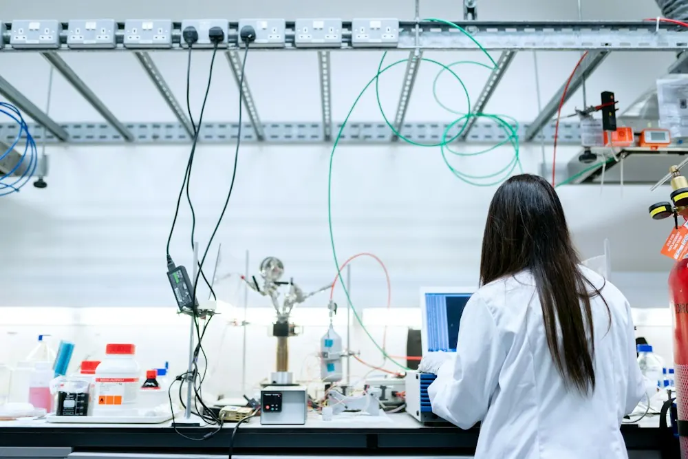 Scientist working at a laboratory bench with instruments