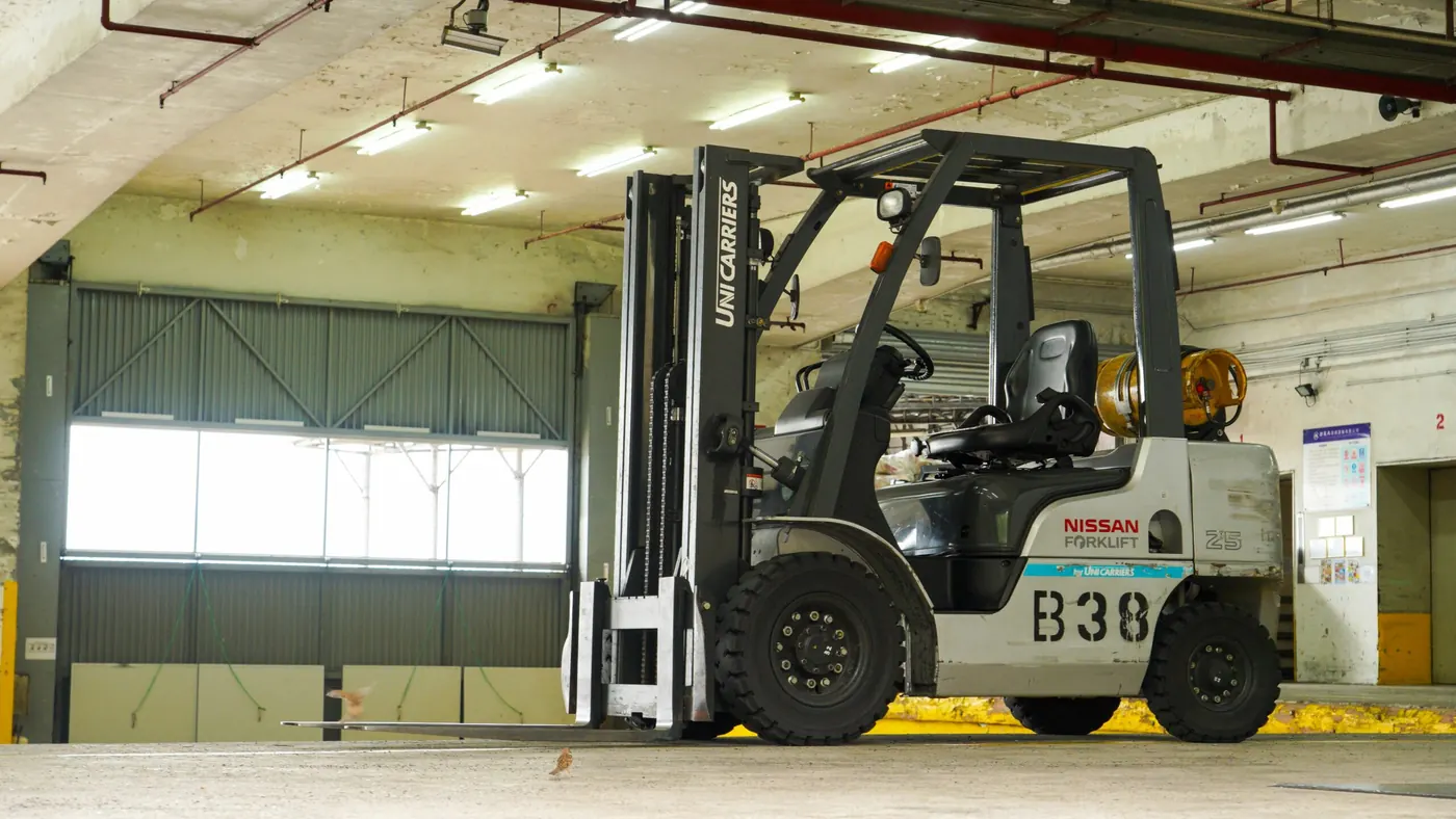 Forklift parked inside a warehouse bay