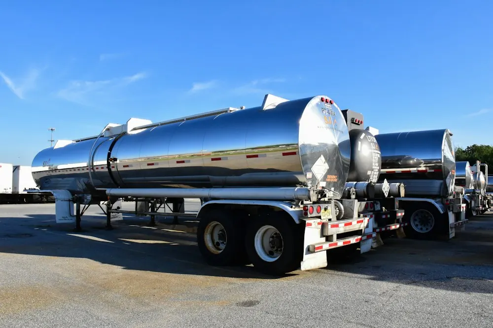 Stainless steel tanker trailers parked in a yard
