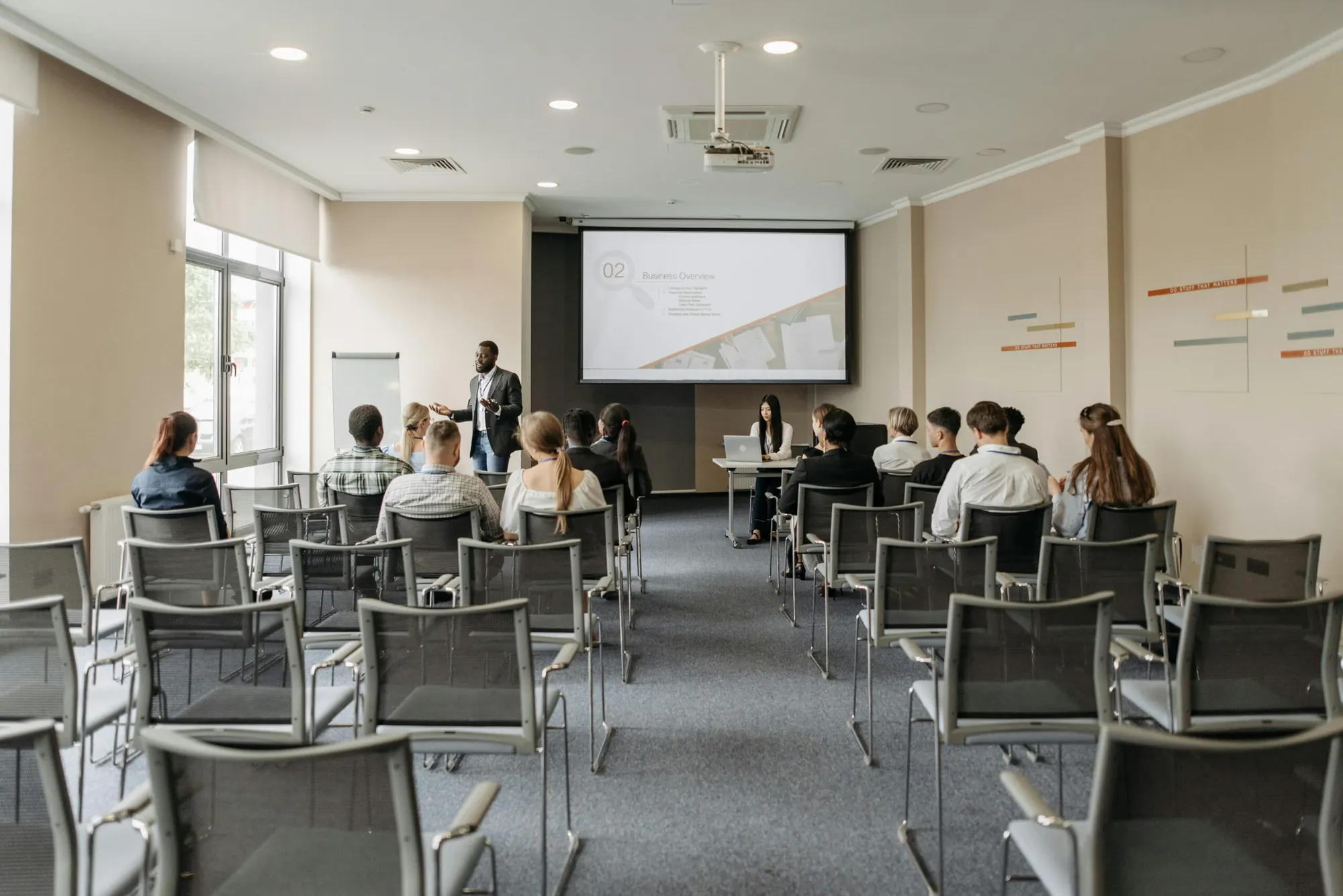 Employees attending a workplace training session in a meeting room