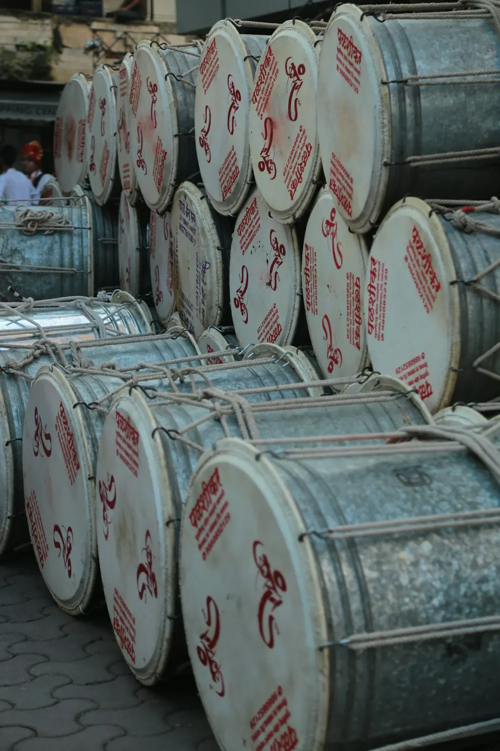 Stacked steel drums in a warehouse